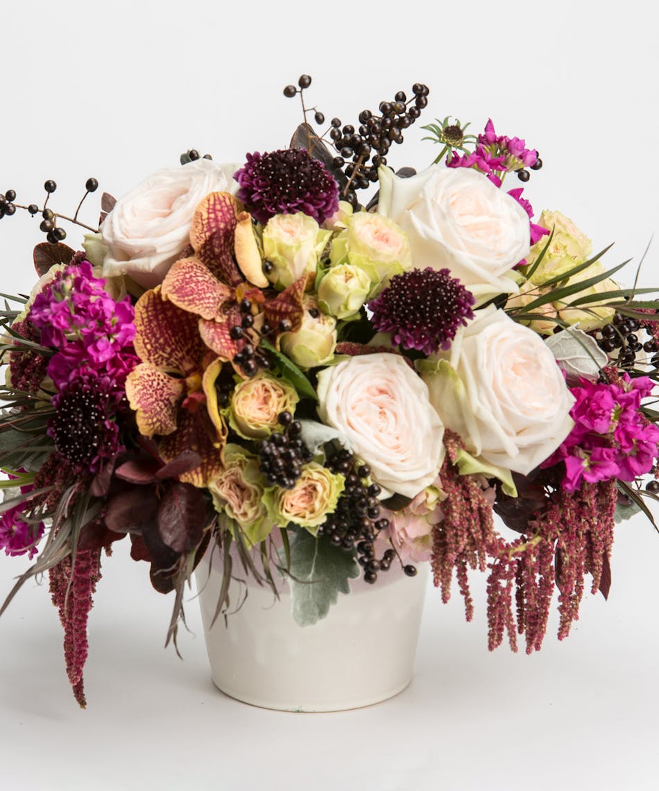 arrangement of crimson, burgundy, and ivory tones