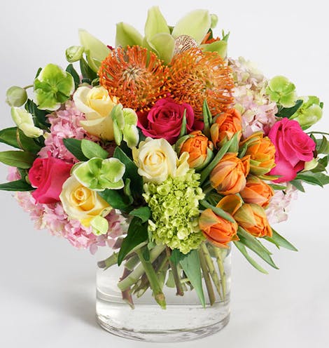 Bright orange, yellow, green and red flowers, artistically arranged